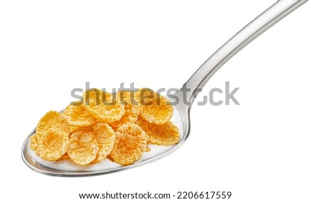 Corn flakes with milk in spoon isolated on white background Royalty-Free Stock Photo #2206617559