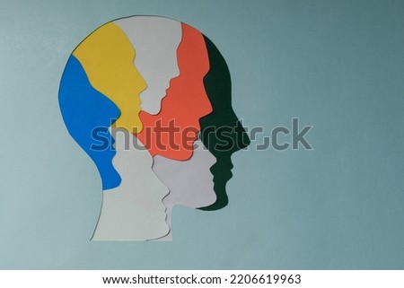 paper cut style Colored silhouette faces in head. Metaphor bipolar disorder, Double face, Split personality, Parkinson, Psychology, Dual personality Mental health concept. Copy space.