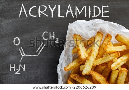 Acrylamide in food. Potato fries and chemical formula of acrylamide. Royalty-Free Stock Photo #2206626289