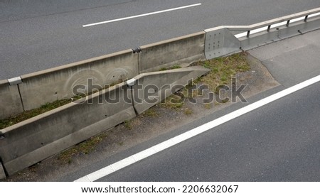 separation of traffic lanes on the highway using movable barriers. they are used in places where the driving directions are too close. during repairs, traffic is re-measured in the opposite direction Royalty-Free Stock Photo #2206632067