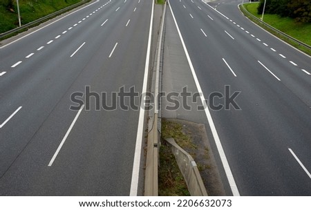 separation of traffic lanes on the highway using movable barriers. they are used in places where the driving directions are too close. during repairs, traffic is re-measured in the opposite direction Royalty-Free Stock Photo #2206632073