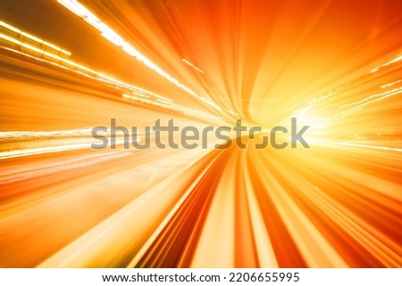 Motion blurred of train moving inside tunnel with daylight in tokyo, Japan. yollow color background concept