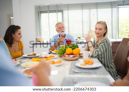 Photo of big family at home, people sit feast dishes table around roasted turkey multi-generation relatives making group with food and pizza in house living room indoors