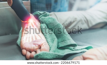 Close up on ultrasound head prepare for treatment on plantar pain,plantar fasciitis, health problem and people concept. Royalty-Free Stock Photo #2206679171