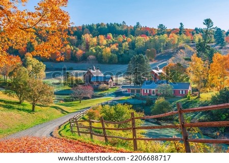 An early autumn foliage scene of houses in Woodstock, Vermont mountains Royalty-Free Stock Photo #2206688717
