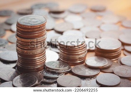 Stacking of money coin on wooden table for financial and investment background. Savings and Accounts, Finance Banking Business Concept Ideas, Investments and Fund. Planning for future. Vintage style.