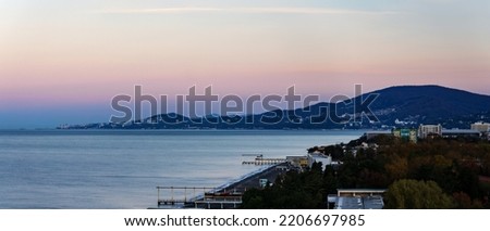 view of the city of Sochi from Adler against the background of the sea surf and sunset sky Royalty-Free Stock Photo #2206697985