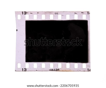 Old 35mm filmstrip or dia slide frame isolated on white background.