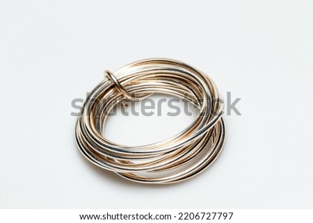 silver wire for jewelry making isolated on white background  Royalty-Free Stock Photo #2206727797