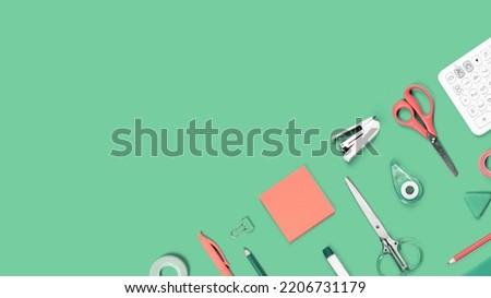 Assorted office and school white orange and green stationery supply on pastel trendy background as knolling. Copy space. Flat lay for back to school or education and craft concept.