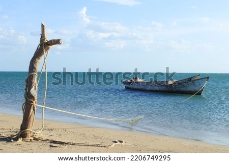 Wooden boat anchored in the caribbean sea