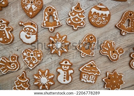 Icing gingerbreads on wooden background. Top view