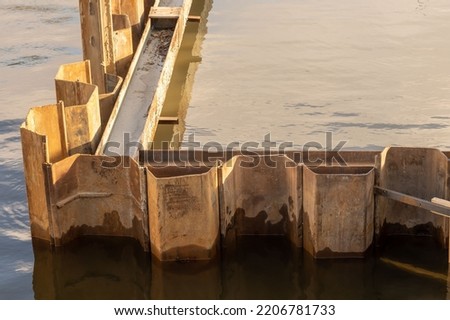 The cofferdam is flooded with water. Space for printing text. Background picture.