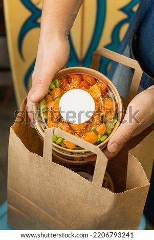 Delivery of biodegradable containers with poke, mockup Royalty-Free Stock Photo #2206793241
