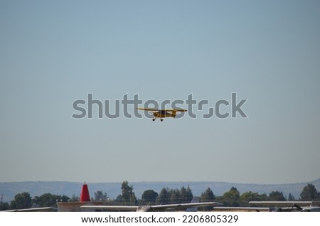 Yellow 1946 vintage airplane.  Picture taken while aircraft is in flight coming in to land. 