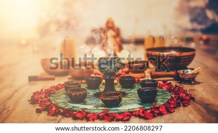 Beautiful altar with rose petals and incense. Cacao ceremony space.
