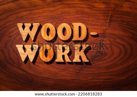 'Woodwork' word - Inscription by wooden letters close up
