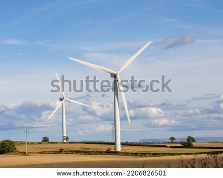 Wind Turbines in the UK Sustainable resource Royalty-Free Stock Photo #2206826501