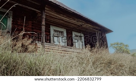 Old wooden of hutsul house on meadow of Carpathian Mountains. Authentic eco living of shepherd in herd koliba village. XIX century buildings in Easter Europe. High quality photo