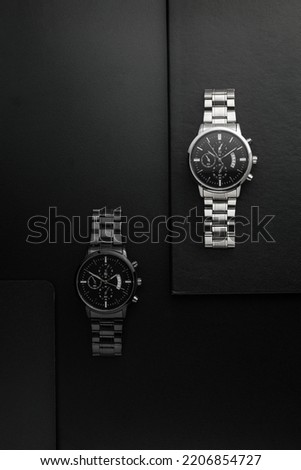 Luxury white and black chrome watches on black background Royalty-Free Stock Photo #2206854727
