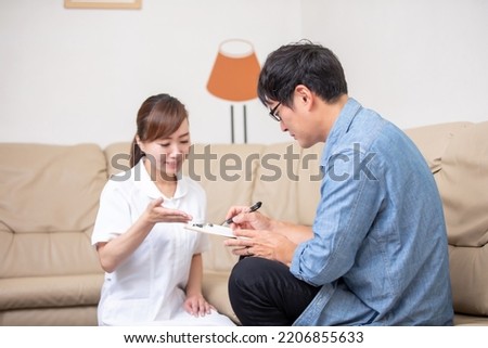 Nurse and patient filling out a questionnaire