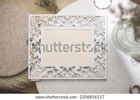 mockup vintage blank photo frame on stone table with sunlight