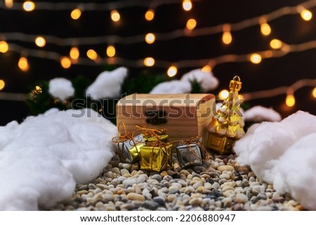 Merry christmas gift box snowy night background