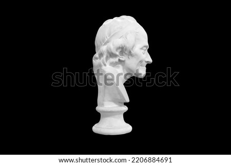 plaster sculpture of a man isolated on a black background. High quality photo
