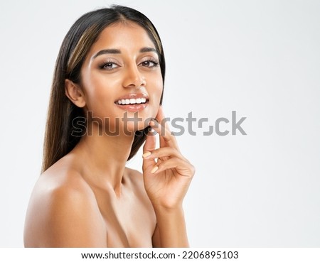 Smiling Model with perfect White Teeth. Beautiful Indian Girl Cheerful Smiling. Beauty Woman with Smooth Skin and Natural Lip Make up over White Background. Female Skincare and Cosmetology Royalty-Free Stock Photo #2206895103