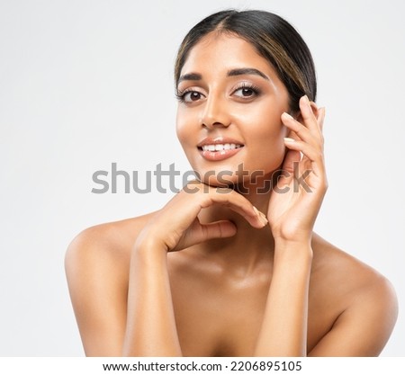 Woman Face Skin Care Cosmetic. Indian Beauty Model showing Perfect Chin and Cheekbones. Women Facial Treatment and Health. Beautiful Girl doing Anti Aging Face Lift Massage over White Royalty-Free Stock Photo #2206895105
