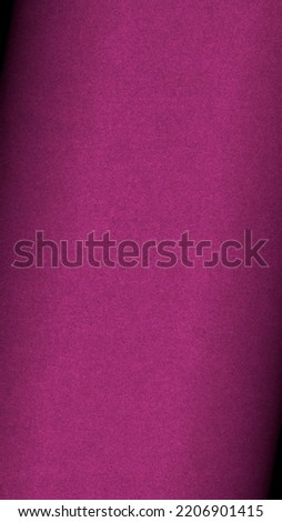 Dark pink colored paper texture. Textured mobile phone wallpaper with vignetting. Tinted vertical background. Small patterned surface. Fibers and irregularities. Top-down