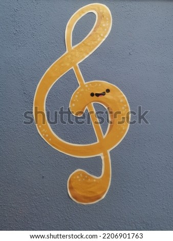 smiley yellow music notes in a grey background isolated 