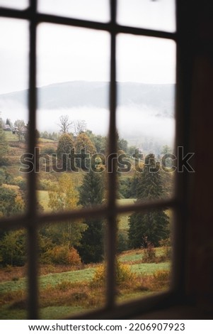 view through the window on a mountain landscape on a cloudy day
