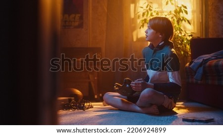 Young Sports Fan Playing with Baseball Ball and Glove at Home in Living Room with Dated Interior. Handsome Boy Enjoying Leisure Time in Nostalgic Retro Childhood Concept.
