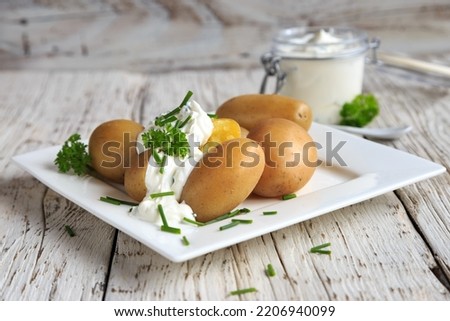 boiled potatoes with sour cream Royalty-Free Stock Photo #2206940099