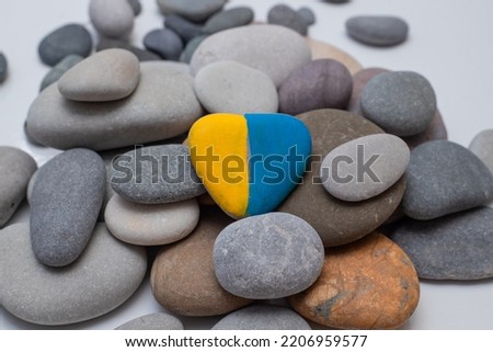 Save Ukraine. Pebbles. Yellow-blue stone - the flag of Ukraine