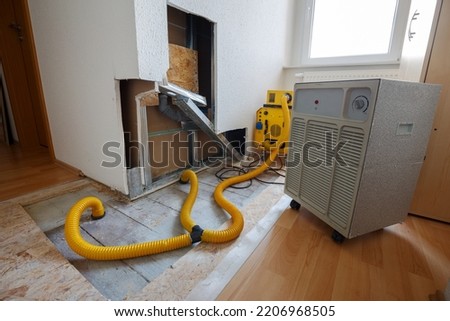 repair of water damage with air dryer Royalty-Free Stock Photo #2206968505