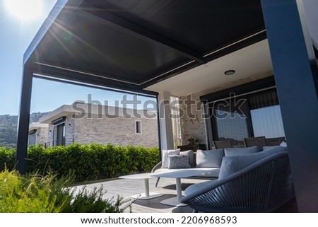 Pergola awning in the sunshine photo Royalty-Free Stock Photo #2206968593