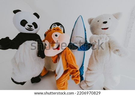 Group of mascots doing party. Concept about carnival, animals rights and lifestyle Royalty-Free Stock Photo #2206970829