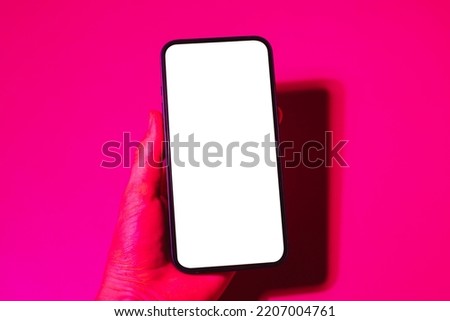Mobile phone mockup in pink and purple light.Design template for concept design. Modern communication. Business app. Digital app mock up. Mock up template. Modern technology device screen.