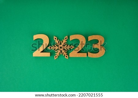 Happy New Year 2023 poster. Christmas background with big gold 2023 numbers. Merry Christmas and Happy New Year. Christmas, winter, new year concept. Greeting card, banner with place for text