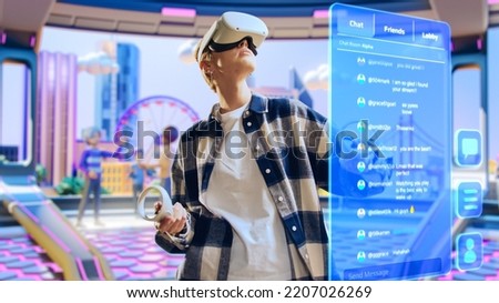 Young Creative Female Wearing a Virtual Reality Headset at Home. Woman Enters Digital Internet 3D Universe And Scrolls Chats with Friends. Next Generation Social Media Online Metaverse Platform. Royalty-Free Stock Photo #2207026269