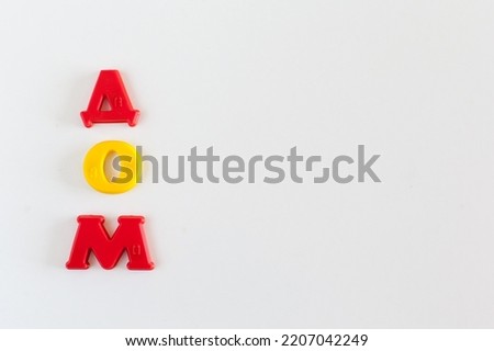 house layout and word made of wooden letters on gray table.