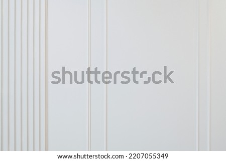 white wall with vertical stripes. high quality photos for designers