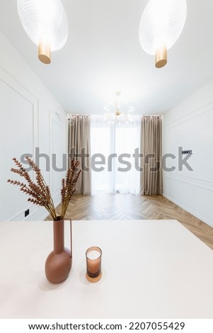 a large New Empty room with a large window, lighting and a table