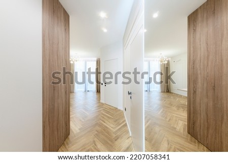 interior design of a new house, a bright corridor with a mirror