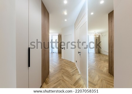 interior design of a new house, a bright corridor with a mirror