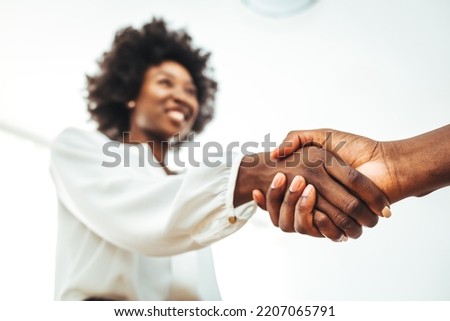 Business handshake for teamwork of business merger and acquisition,successful negotiate,hand shake,two businessman shake hand with partner to celebration partnership and business deal concept Royalty-Free Stock Photo #2207065791