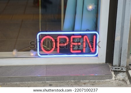 An Open Sign, neon light sign. 