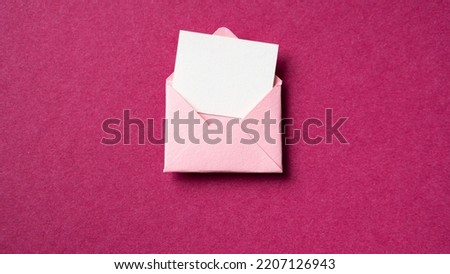Blank white card with pink paper envelope template mock up on dark pink background